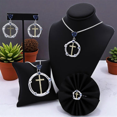 Sterling Silver and 18k yellow gold jewelry with natural topaz in multiple colors of blue and white.  The center of the earrings, ring, and pendant is a cross. The pendant is on an 18 inch sterling silver chain.